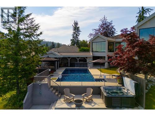 Hot tub, Fire Bowl, Outdoor Shower - 228 Caliburn Court, Kelowna, BC - Outdoor With Deck Patio Veranda