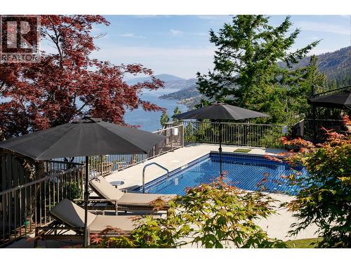 Mature Gardens and Trees - 228 Caliburn Court, Kelowna, BC - Outdoor With In Ground Pool