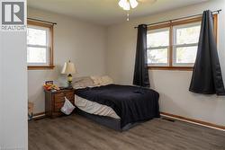 Neutral wall paint complemented by wood-finish flooring - 