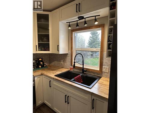 5620 49 Street, Fort Nelson, BC - Indoor Photo Showing Kitchen With Double Sink