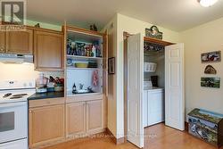 Main floor laundry with utility sink - 