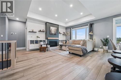 50 Faith Drive, Mapleton, ON - Indoor Photo Showing Living Room With Fireplace