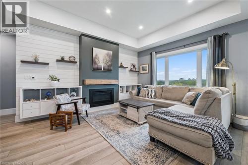 50 Faith Drive, Mapleton, ON - Indoor Photo Showing Living Room With Fireplace