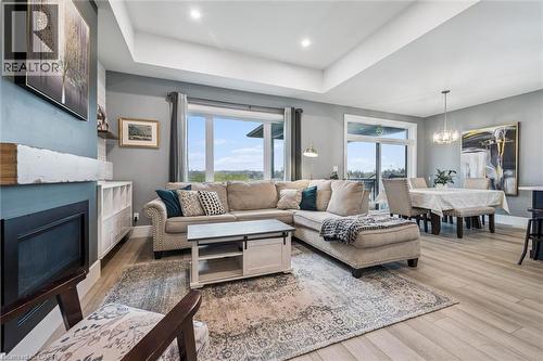 50 Faith Drive, Mapleton, ON - Indoor Photo Showing Living Room With Fireplace