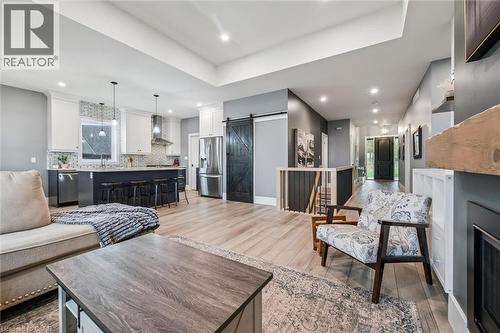 50 Faith Drive, Mapleton, ON - Indoor Photo Showing Living Room With Fireplace