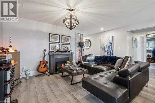 50 Faith Drive, Mapleton, ON - Indoor Photo Showing Living Room With Fireplace