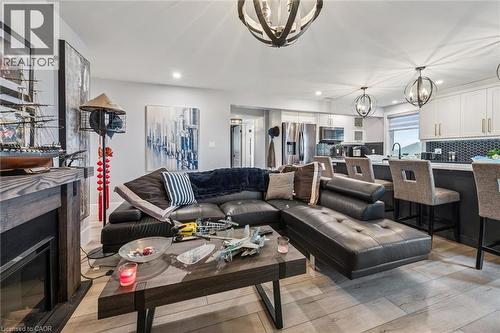 50 Faith Drive, Mapleton, ON - Indoor Photo Showing Living Room With Fireplace