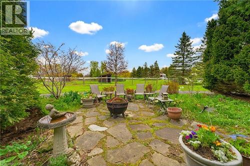 Stone patio area with surrounding greenery - 10 Huisman Lane, Hamilton, ON 