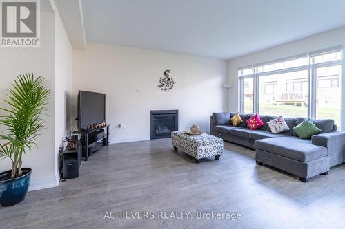 47 Daffodil Road, Springwater, ON - Indoor Photo Showing Living Room With Fireplace