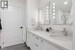 Double vanity with integrated sinks and white countertops - 