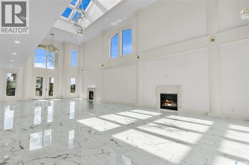 4204 Elderberry Crescent E, Regina, SK - Indoor Photo Showing Other Room With Fireplace