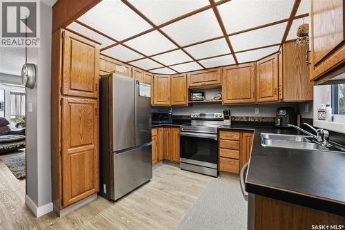 6962 Maple Brook Crescent, Regina, SK - Indoor Photo Showing Kitchen With Double Sink