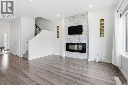 234 Brighton Gate, Saskatoon, SK - Indoor Photo Showing Living Room With Fireplace