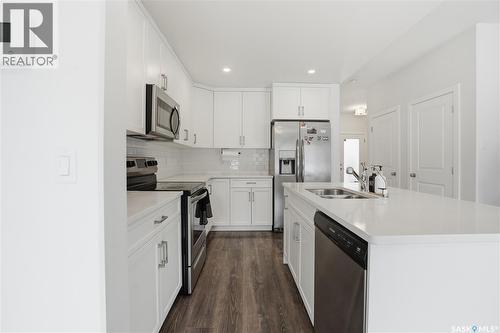 234 Brighton Gate, Saskatoon, SK - Indoor Photo Showing Kitchen With Stainless Steel Kitchen With Double Sink With Upgraded Kitchen
