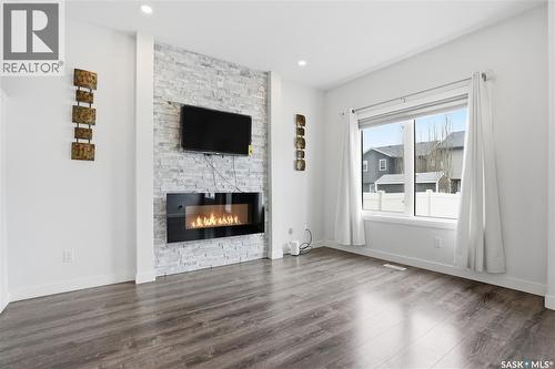 234 Brighton Gate, Saskatoon, SK - Indoor Photo Showing Living Room With Fireplace