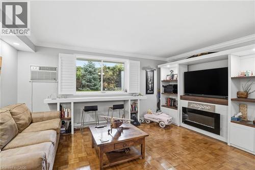482 James Street N Unit# 104, Hamilton, ON - Indoor Photo Showing Living Room With Fireplace