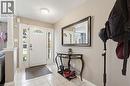 Entryway with white panel door featuring an arched window, flanked by sidelight windows and a transom - 47 Hannah Crescent, Hamilton, ON  - Indoor Photo Showing Other Room 