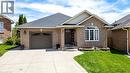 Brick exterior featuring a single-car garage, concrete driveway, and a front entry with a covered porch - 47 Hannah Crescent, Hamilton, ON  - Outdoor With Facade 