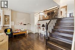 Dark wood-finish flooring throughout the main level - 