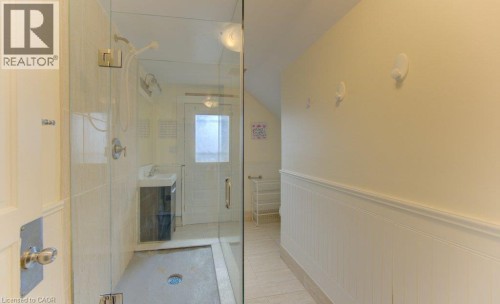 Glass-enclosed shower with tile surround and rain showerhead - 10 Marshall Street, Waterloo, ON 