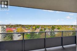 Balcony with dark gray railing and opaque lower panels - 