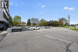 Surface parking area with a separate ramp leading to an underground parking garage - 