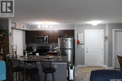 404 820 5Th Street Ne, Weyburn, SK - Indoor Photo Showing Kitchen With Double Sink