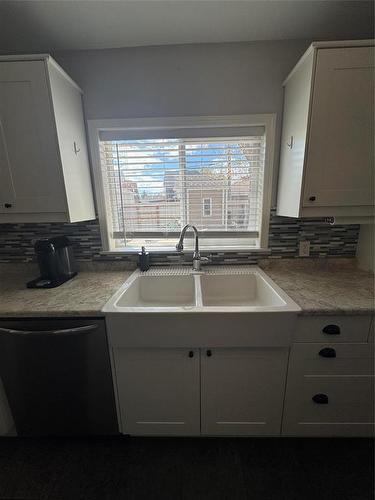 450 3Rd Street, Brandon, MB - Indoor Photo Showing Kitchen With Double Sink