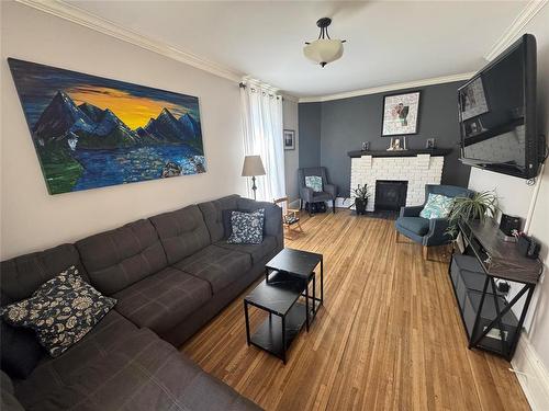 450 3Rd Street, Brandon, MB - Indoor Photo Showing Living Room With Fireplace