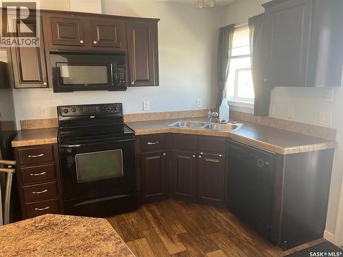320 3Rd Avenue W, Christopher Lake, SK - Indoor Photo Showing Kitchen With Double Sink