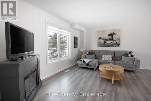 110 Leeson Street S, East Luther Grand Valley, ON - Indoor Photo Showing Living Room With Fireplace