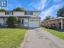 Two-story residence featuring light-colored siding, a dark roofline, and contrasting black window shutters - 833 Doon Village Road, Kitchener, ON  - Outdoor With Facade 