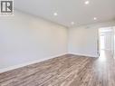 Spacious room with wood-finish flooring, recessed lighting, white baseboards, and neutral wall tones - 833 Doon Village Road, Kitchener, ON  - Indoor Photo Showing Other Room 