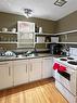17 Empress Bay, Brandon, MB  - Indoor Photo Showing Kitchen With Double Sink 