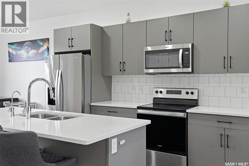 187 Rosewood Boulevard E, Saskatoon, SK - Indoor Photo Showing Kitchen With Stainless Steel Kitchen With Double Sink With Upgraded Kitchen