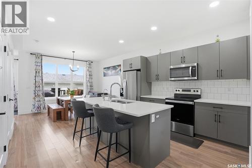 187 Rosewood Boulevard E, Saskatoon, SK - Indoor Photo Showing Kitchen With Stainless Steel Kitchen With Double Sink With Upgraded Kitchen
