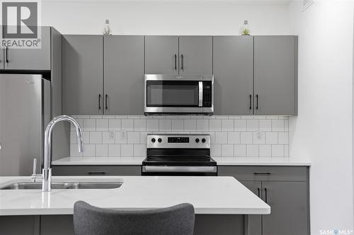 187 Rosewood Boulevard E, Saskatoon, SK - Indoor Photo Showing Kitchen With Stainless Steel Kitchen With Double Sink With Upgraded Kitchen