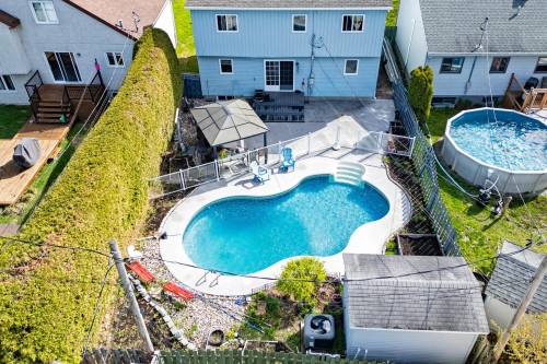 Photo aérienne - 577 Rue Sauriol, Saint-Eustache, QC - Outdoor With Above Ground Pool With Deck Patio Veranda