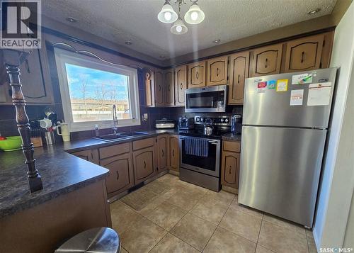 15 Mackenzie Drive, Yorkton, SK - Indoor Photo Showing Kitchen With Double Sink