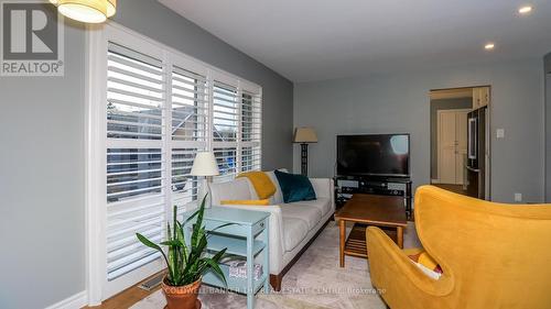 Patio Doors from Family Room to Deck - 33 Elvyn Crescent, Oro-Medonte, ON - Indoor Photo Showing Living Room