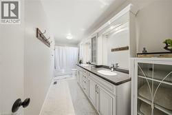 Bathroom featuring double vanity and shower / bath combo - 