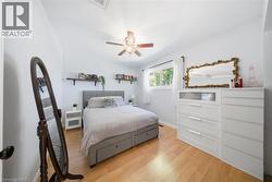 Bedroom featuring light wood-style flooring and ceiling fan - 