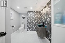 Half bath with vanity, recessed lighting, and light tile patterned flooring - 