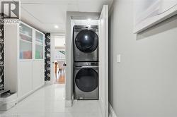Laundry area featuring stacked washer / dryer - 