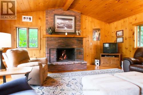 1 Brill'S Island, Nipissing, ON - Indoor Photo Showing Living Room With Fireplace