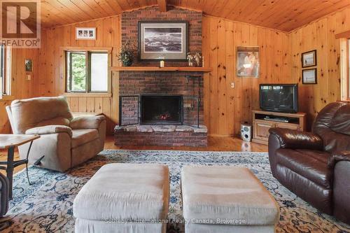 1 Brill'S Island, Nipissing, ON - Indoor Photo Showing Living Room With Fireplace