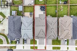 Aerial perspective highlighting a residential property with a clearly defined boundary - 