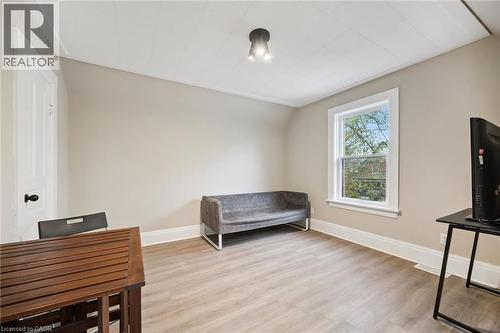 Light-toned wood-finish flooring complements neutral wall tones - 15 Gordon Avenue, Kitchener, ON - Indoor