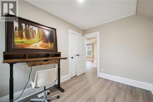 Light-toned walls with contrasting white trim, wood-finish flooring, and a white ceiling with recessed lighting - 15 Gordon Avenue, Kitchener, ON - Indoor Photo Showing Other Room