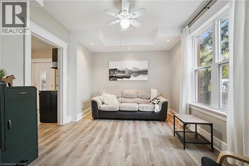 Living area with wood-finish flooring, recessed lighting, and a ceiling fan - 15 Gordon Avenue, Kitchener, ON - Indoor